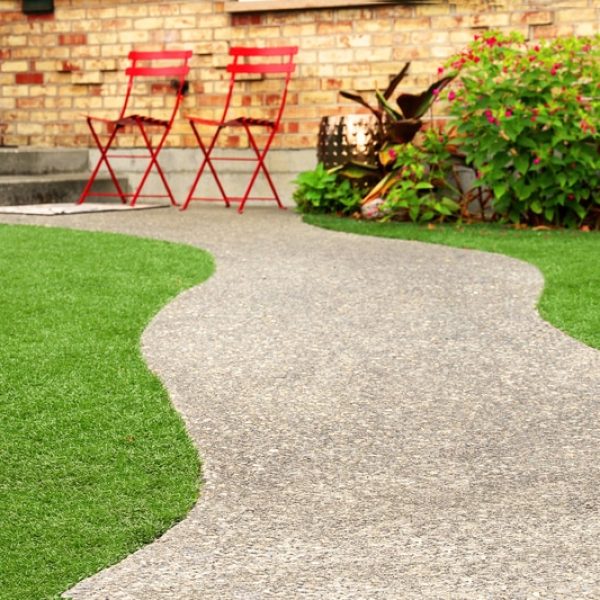 walk-way-with-perfect-grass-landscaping-with-artificial-grass-in-residential-area-44112460